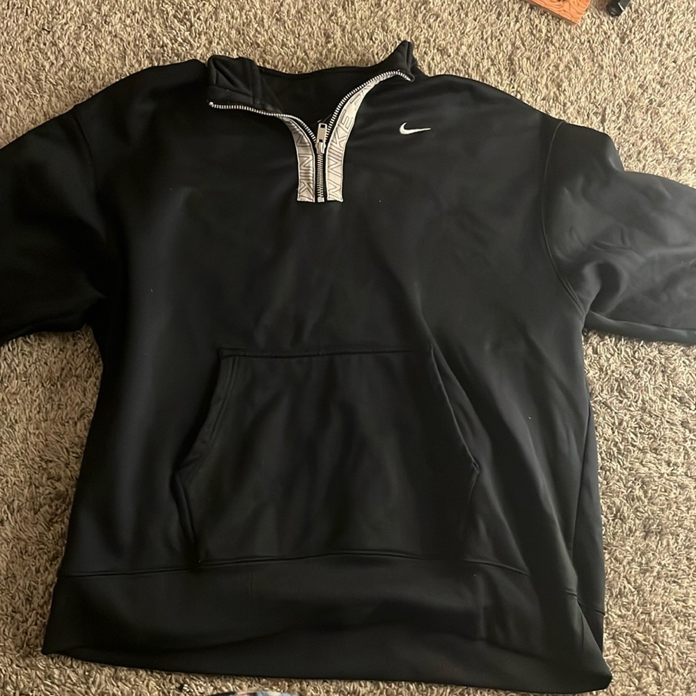 This is a Nike jacket it is black with white and it is a size L